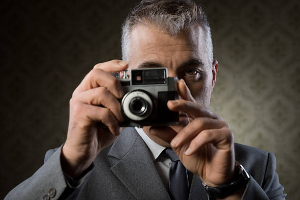 istock Photographer with vintage camera 477361407