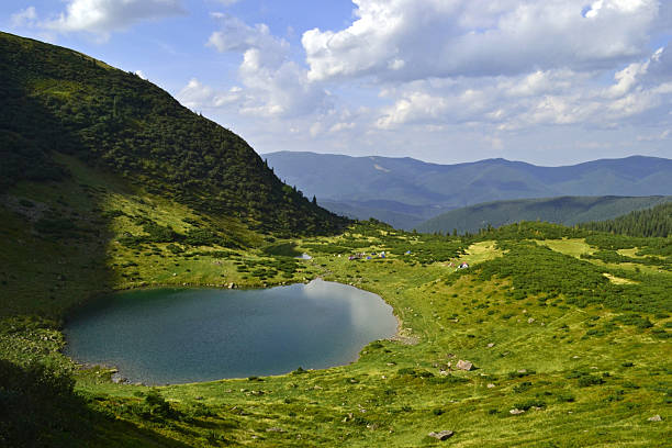 istock lake in a valley among the mountains 477363059