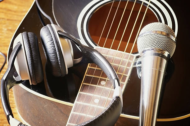 istock instrument guitar headphones and microphone 477363226