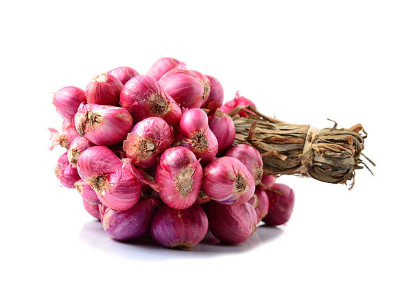 istock Shallots, Raw and uncooked isolated on white background 477365674