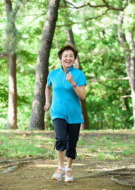 istock Senior Asian woman runner 477368758