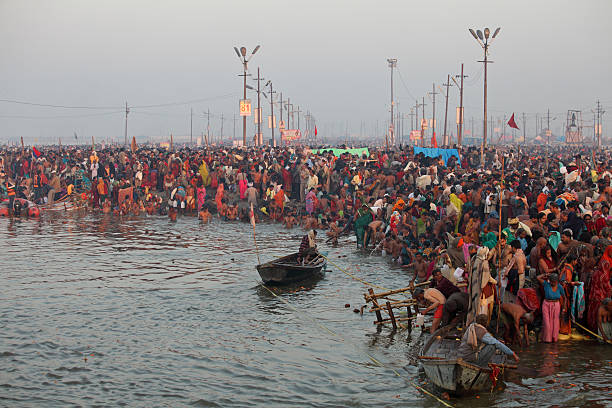 Kumbh Mela - the world's largest religious gathering Allahabad, India - February 10, 2013: Allahabad, India - February 10, 2013:Thousands of Hindu devotees come to the confluence of the Ganges and the Yamuna River for holy dip during the festival Kumbh Mela. It is the world's largest religious gathering prayagraj photos stock pictures, royalty-free photos & images