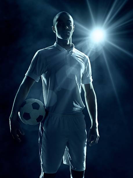 istock Soccer Player with ball 477373085