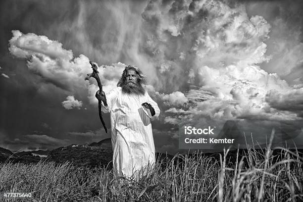 Longhaired Prophet Gesturing In Front Of Dramatic Sky Stock Photo - Download Image Now