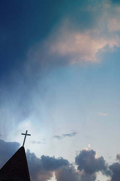 istock Church steeple with cross at sunset  Copy space 477378356