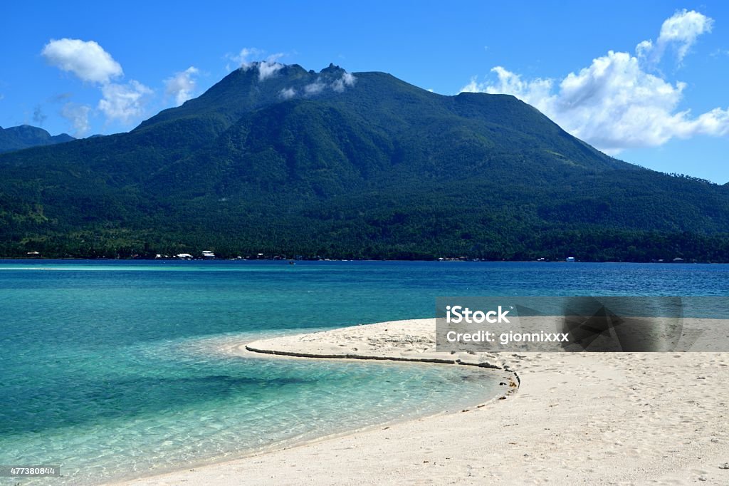 Idyllic white Island and Camiguin volcano, Philippines Idyllic White Island with Hibok-Hibok volcano in the background. It's an uninhabited white sandbar located off the northern shore of Mambajao in Camiguin island, Philippines.  Camiguin Island Stock Photo