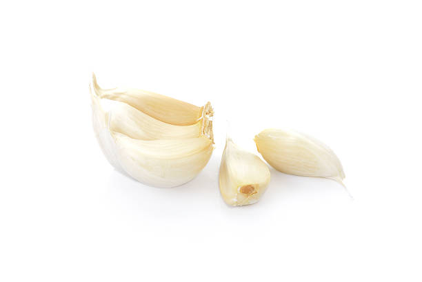 istock garlic isolated on white background, garlic macro 477380996