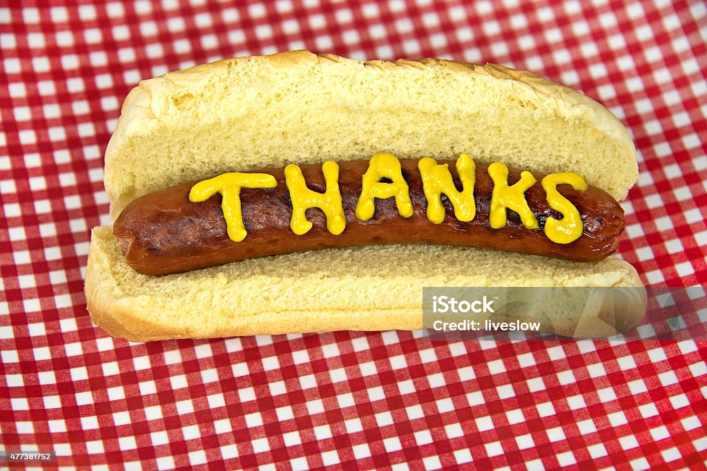 thanks on hot dog with mustard Thanks written in mustard on a hot dog with bun. Thank You - Phrase Stock Photo
