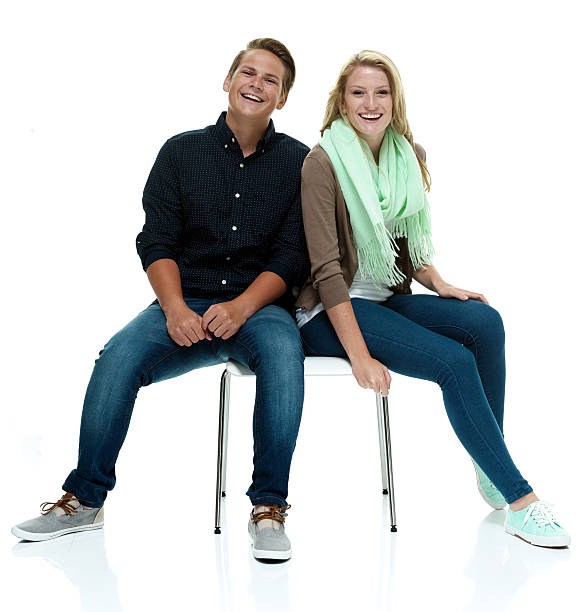 istock Smiling couple sitting on chair 477381956