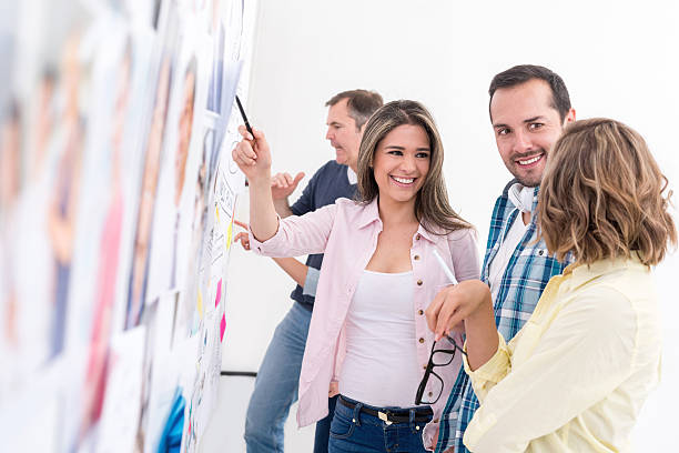 istock Group of people working at a creative office 477385388