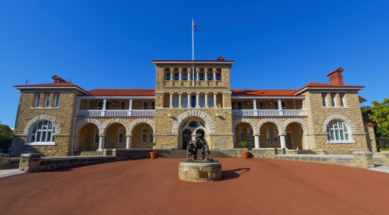 Perth Mint building, one of three branches as part of the Royal Australian Mint. Limestone building built in 1899. Facade with a statue of prospectors striking gold.