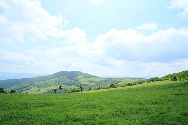 istock green  field and  blue  sky  ( The Sodeyama  highlands ) 477386979