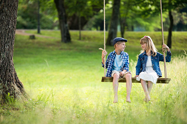 istock Two Best Friends On A Swing 477390690