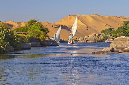 Two typical Egyptian sailing boat on the Nile near Aswan and Elephantine Island.