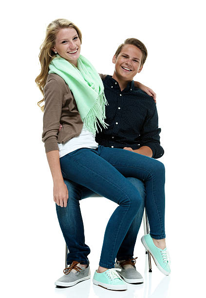 istock Smiling couple sitting on chair 477392004