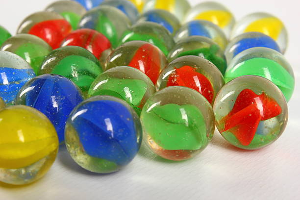 istock Blue, red, yellow and green marbles 477392467