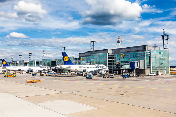 Terminal 1 with aircraft at gate in Frankfurt Frankfurt, Germany - June 13, 2015: Terminal 1 with airecraft at gate in Frankfurt, Germany. With 38 million passengers per year it is one of the most important airport in Europe. frankfurt international airport stock pictures, royalty-free photos & images