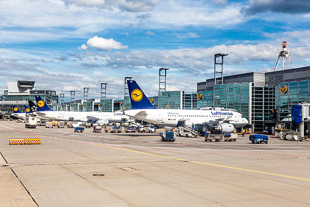Terminal 1 with aircraft at gate in Frankfurt Frankfurt, Germany - June 13, 2015: Terminal 1 with airecraft at gate in Frankfurt, Germany. With 38 million passengers per year it is one of the most important airport in Europe. frankfurt international airport stock pictures, royalty-free photos & images
