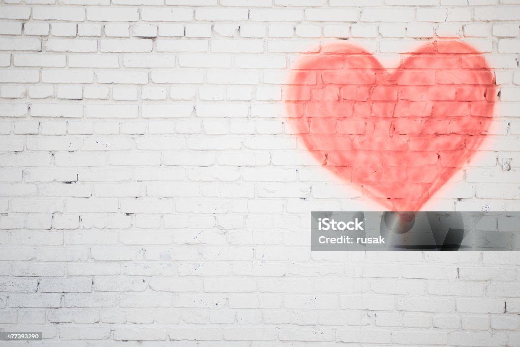 red heart white brick wall with red heart background Heart Shape Stock Photo