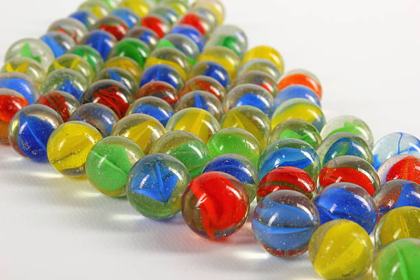 istock Blue, red, yellow and green marbles 477393431