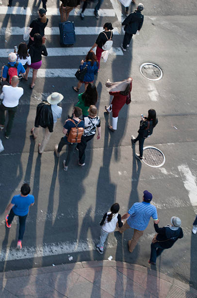 istock People crossing the street from above 477393878