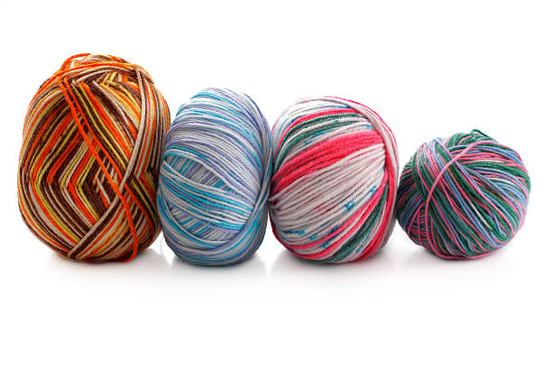 istock melange few balls of wool on a white background 477394861