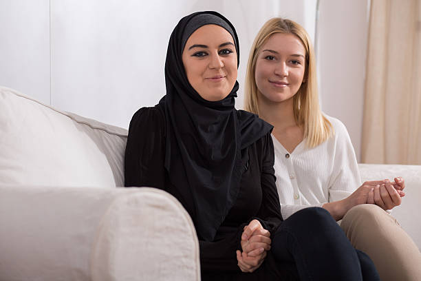 istock Arab and caucasian woman 477396488