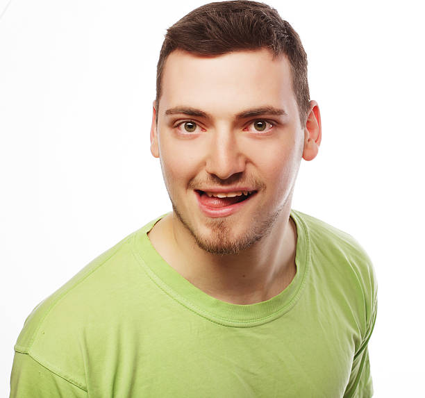 istock happy young man in green t-shirt 477399046