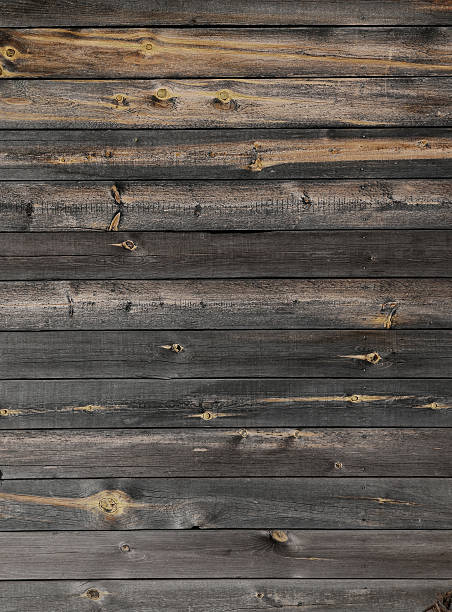 istock Old weathered plank wood background 477400316