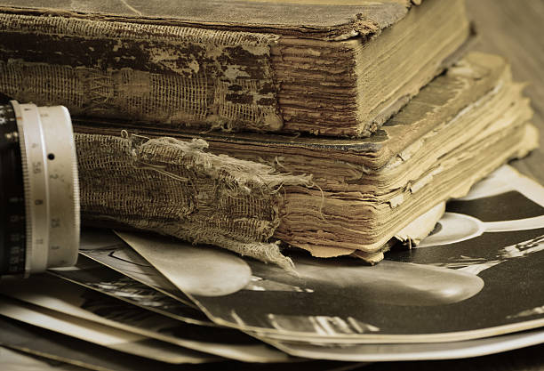 istock Old books, lens and black-and-white photographs 477400546