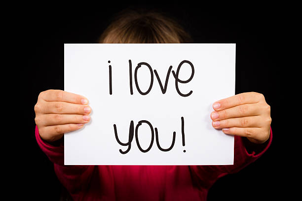 istock Child holding I Love You sign 477400740