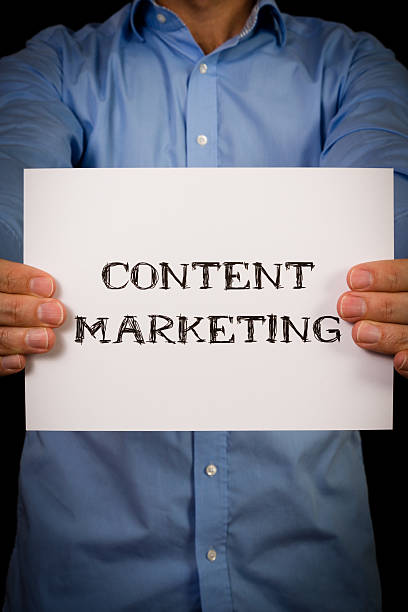 istock Man with Content Marketing sign 477401148
