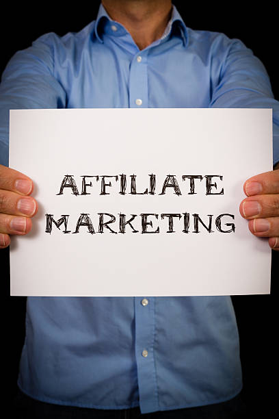 istock Man with Affiliate marketing sign 477401160