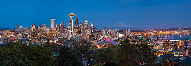 istock Seattle downtown skyline and Mt. Rainier at night, Washington 477401506