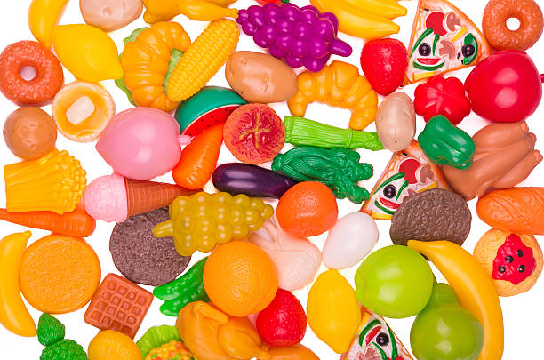 istock Plastic game, fake varied vegetables and fruits. background 477401807