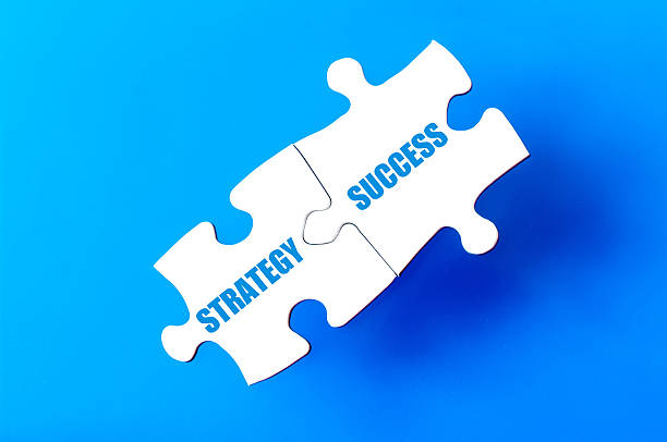 istock Connected puzzle pieces with words STRATEGY and SUCCESS 477403574