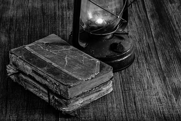 Old books and oil lamp