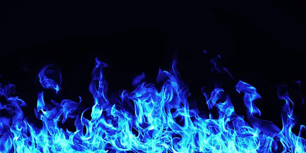 Photo of burning blue  fire flame on black background