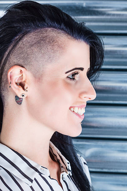 istock Woman With A Part-shaved Head And Tattoos 477407980