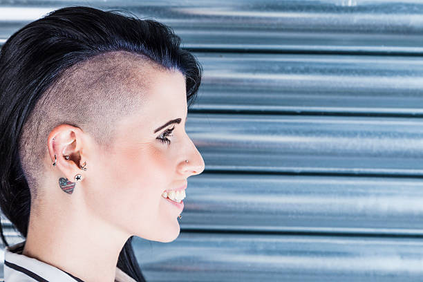 istock Woman With A Part-shaved Head And Tattoos 477408012