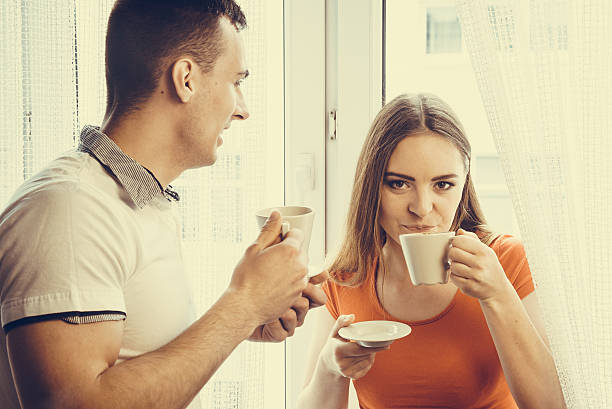 istock young couple drinking tea or coffee at home 477408044
