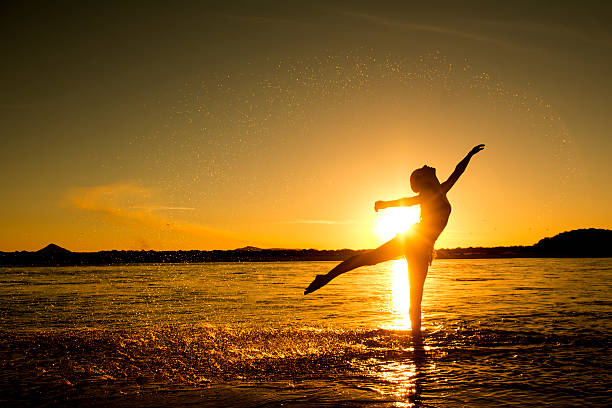 istock Girl dancing in the water 477408192