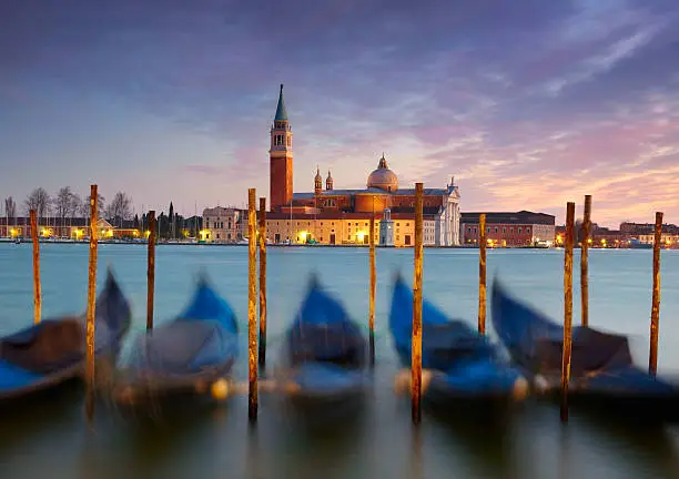 Gondolas on Saint Mark square with San Giorgio di Maggiore church in the background.  Venice, Venezia, Italy, Europe