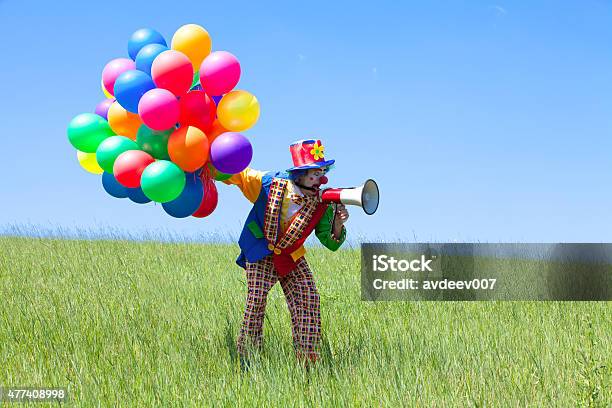 Clown Holding Balloons And Crying To Megaphone Stock Photo - Download Image Now - 2015, Actor, Adult