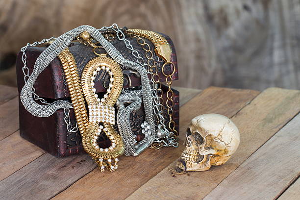 istock Still Life skull and small box with treasures on wooden 477410812