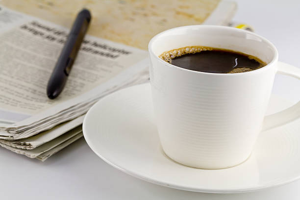 istock cup of coffee and newspaper 477411715