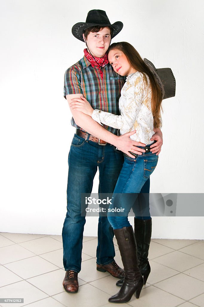 Cowboy's love story The guy and the girl in cowboy's suits on a white background 2015 Stock Photo