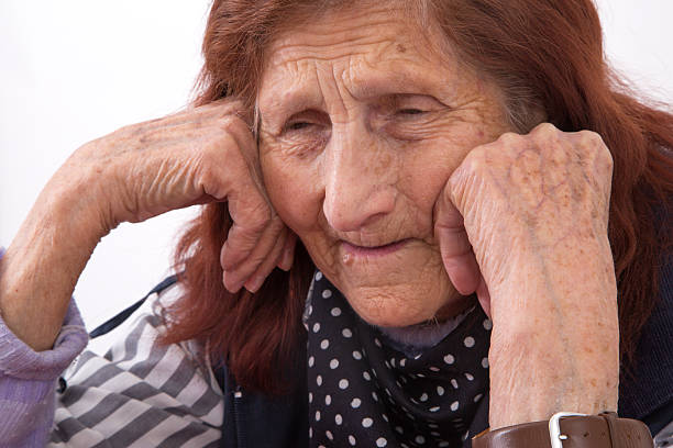 istock Portrait of an elderly woman with sad face expression 477412584
