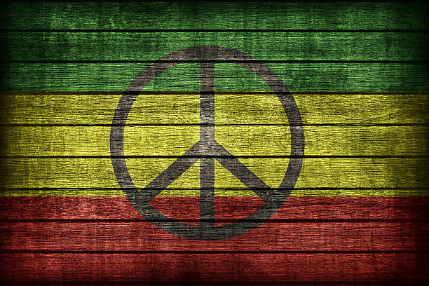 istock Rasta flag pattern with a peace on wooden board texture 477412726