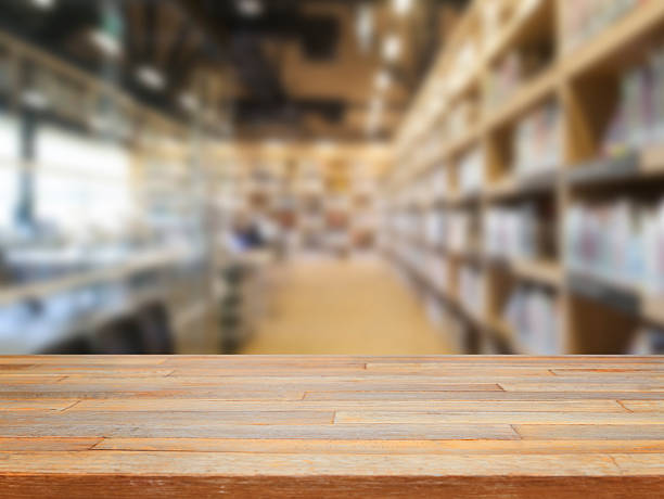 istock Empty wooden table and modern library background, product displa 477413142